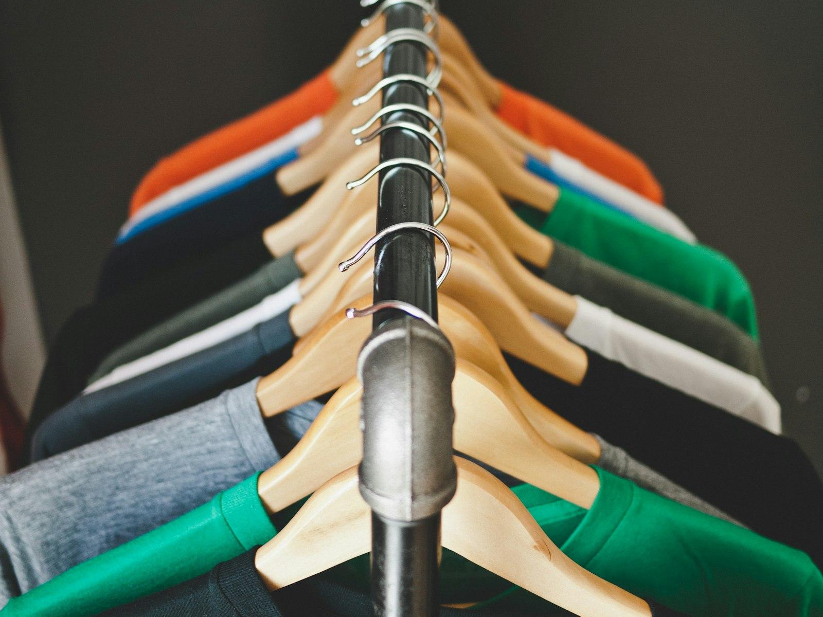 Freshly pressed, colourful shirts hanging on a rack